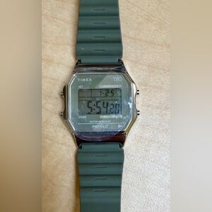 Timex T80 34mm digital watch with a resin strap in an olive green color